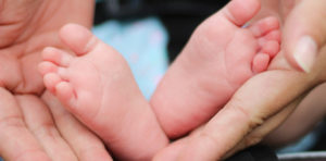 baby foot in hands
